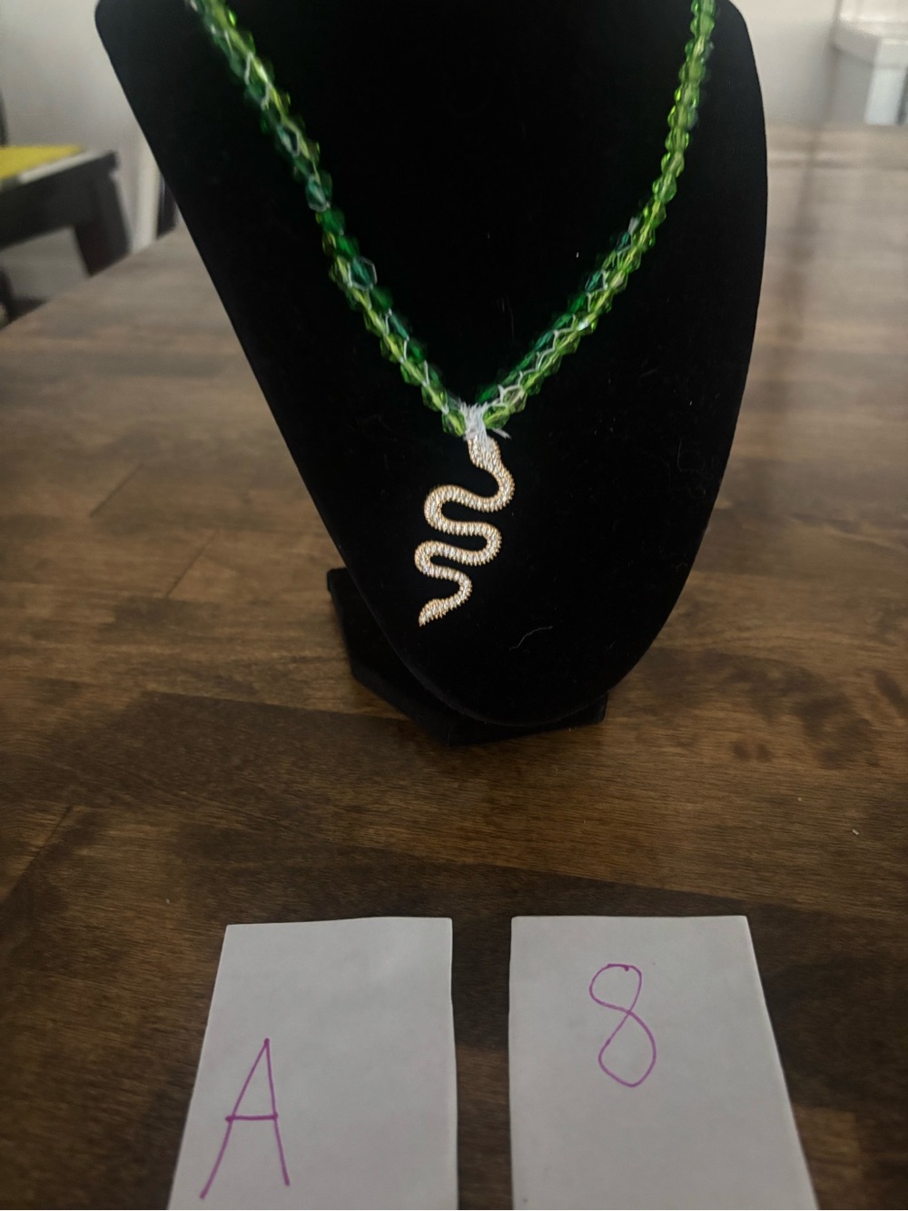 Green Braided Necklace with Sparkling Snake Pendant